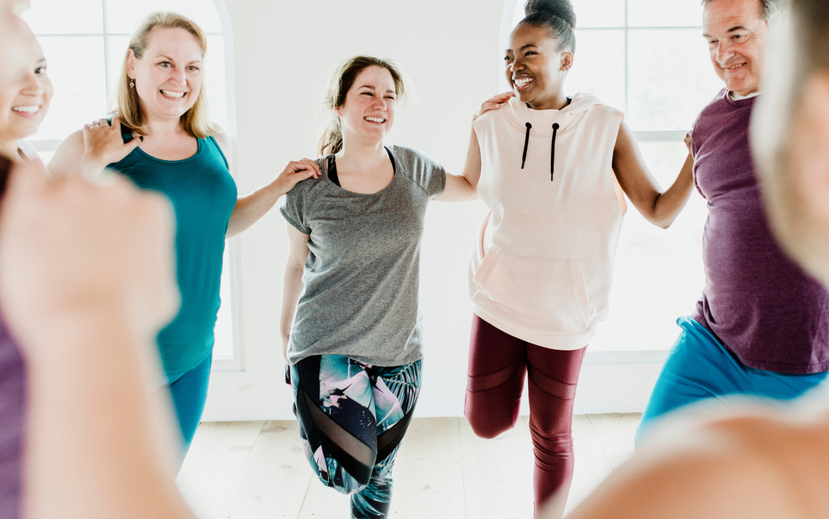 Group of people doing quadriceps stretching